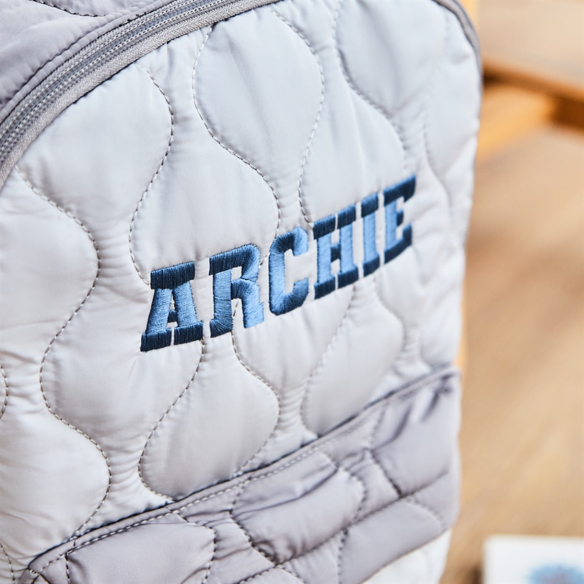 Personalised Large Grey Quilted Blue Name Varsity Backpack 