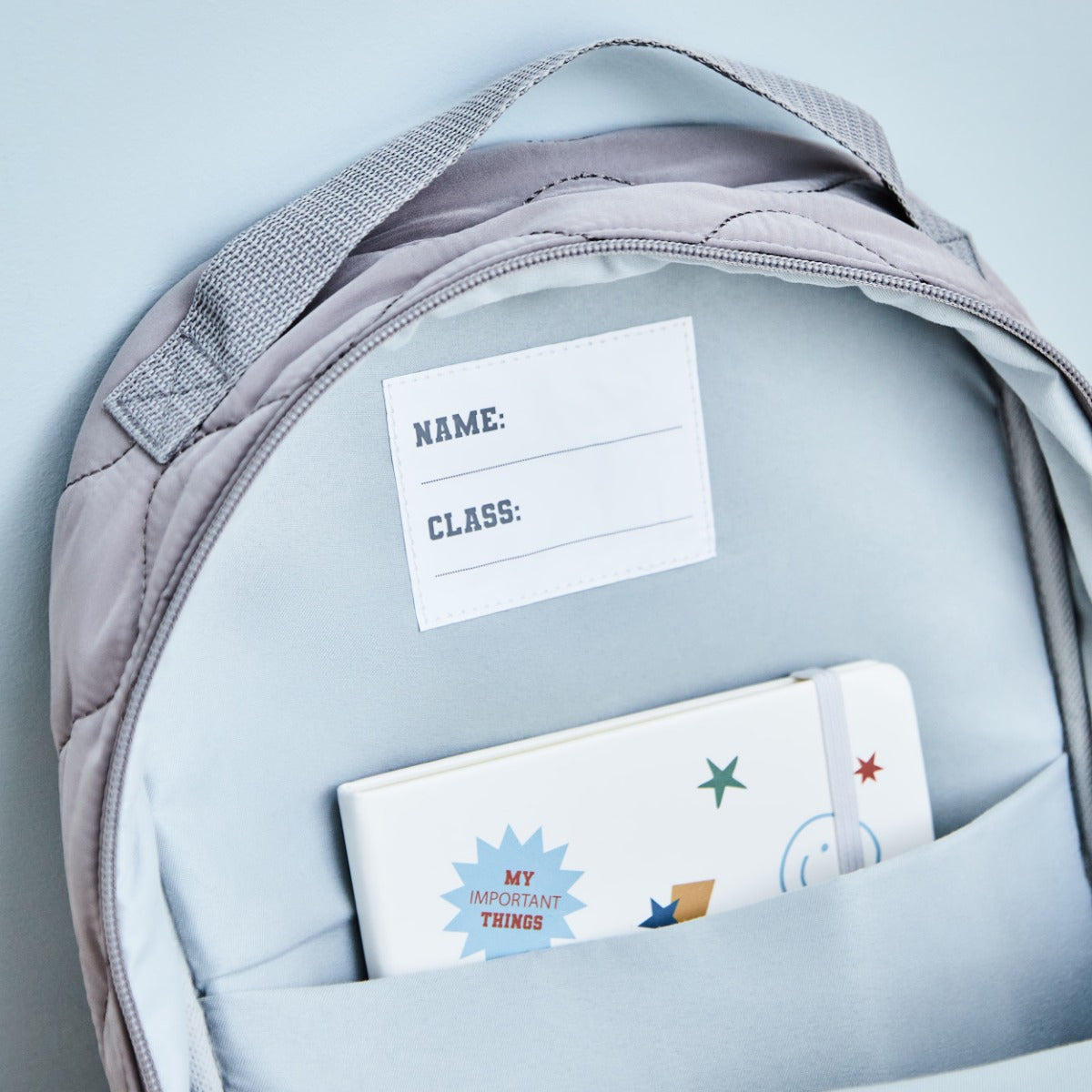 Personalised Large Grey Quilted Blue Name Varsity Backpack 
